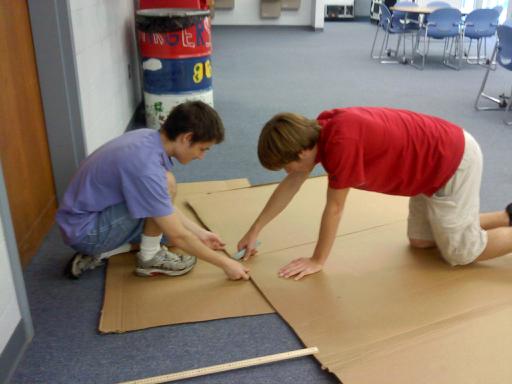 Physics students working on their cardboard boats.